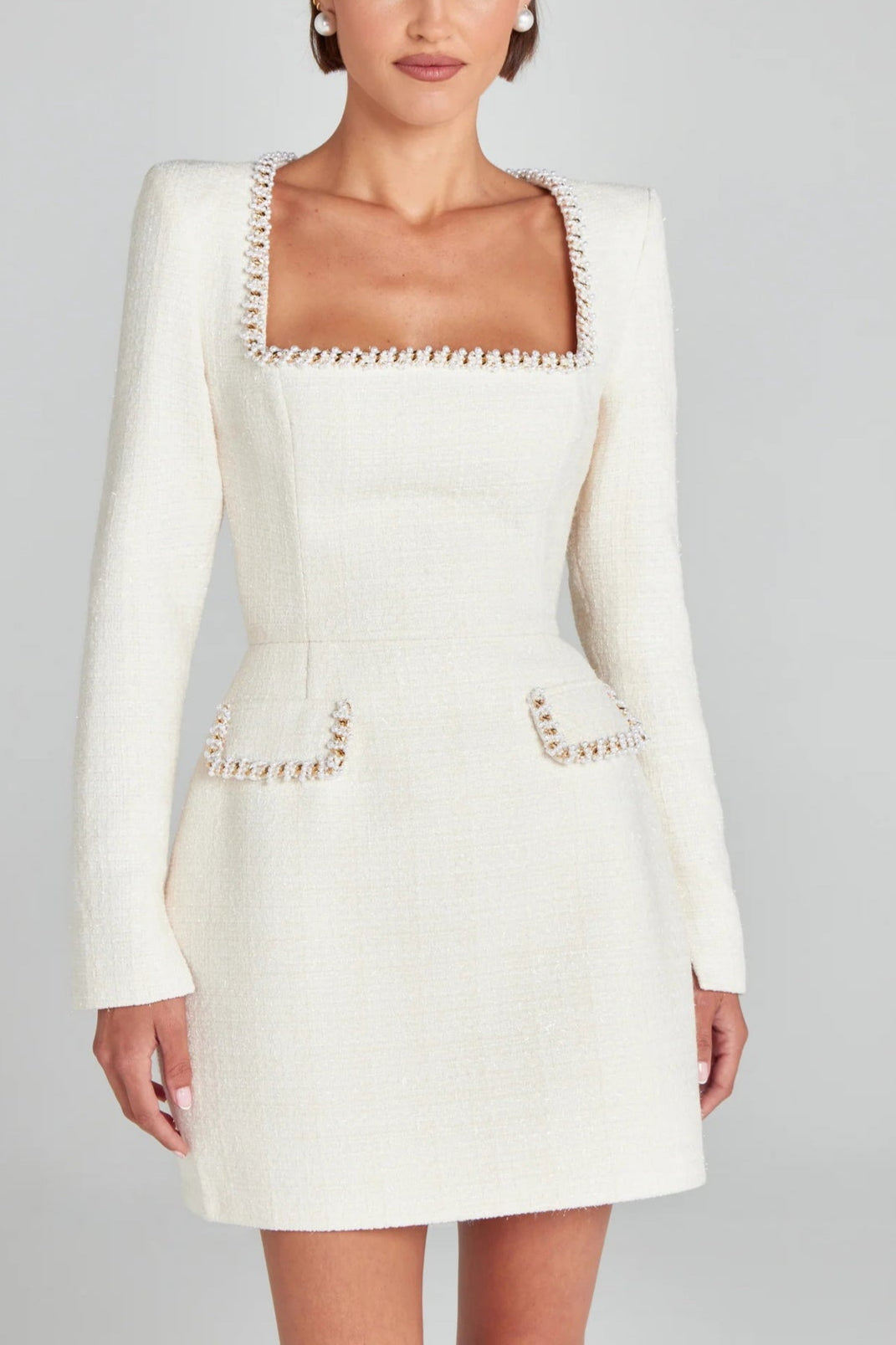 Elegant and Playful Mini Dress with Pockets and Pearl Trim
